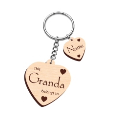 Custom laser engraved plywood keyring with 7 decorative name hearts featuring small heart details for grandchildren