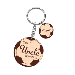 Personalised wooden football keyring engraved with "This Uncle belongs to" and a small round name charm for a soccer fan.
