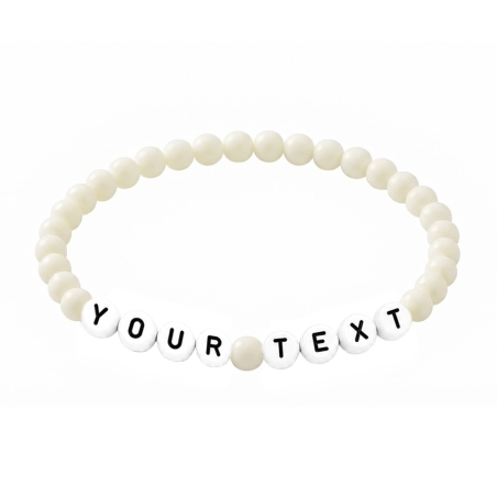 Cream personalised 6mm acrylic bead bracelet with glossy cream beads and custom lettering